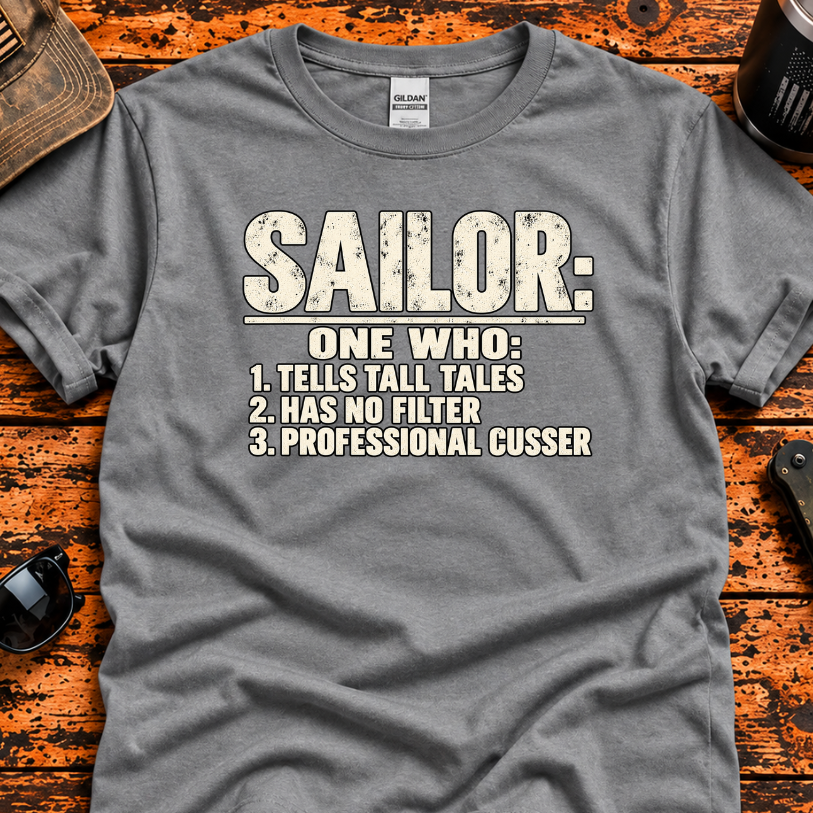 A heather gray crewneck t-shirt with a distressed white graphic print that reads 'SAILOR: ONE WHO: 1. TELLS TALL TALES 2.